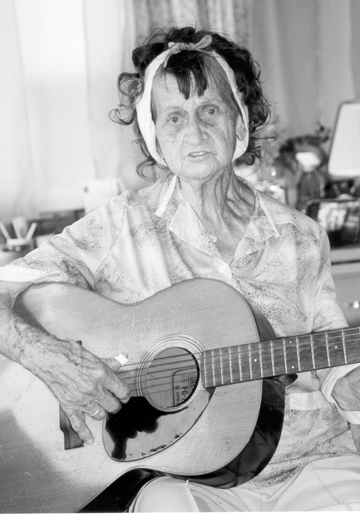 Sadie playing guitar, 2002