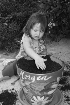 Morgen covering up her seeds